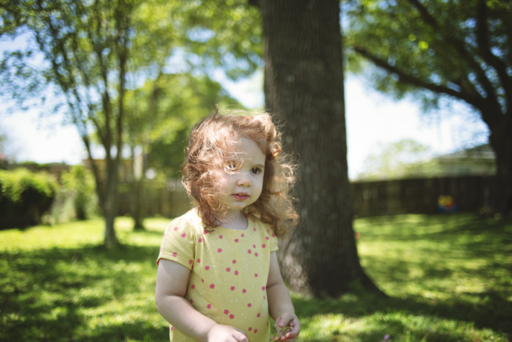 Little Girl with red hair outside in wind